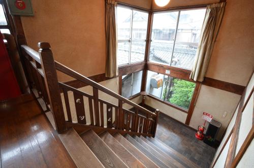 an overhead view of a staircase with two windows at Asanokan in Ise