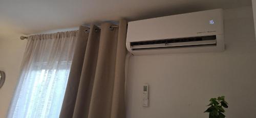 Sunny 1-BR apartment with AC and private terrace near the ocean