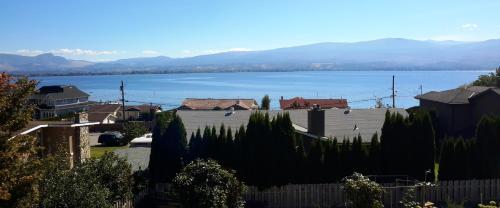 a view of a town with a large body of water at Casa Loma BnB in West Kelowna
