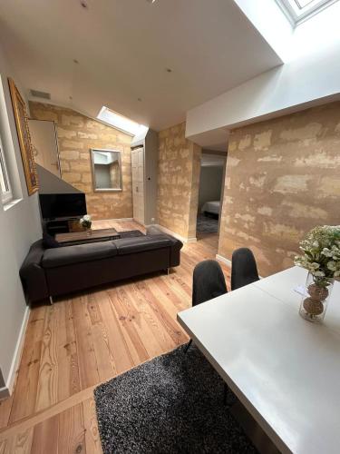 Saint-Michel Bordeaux Atypical Stone-Wall Apartment by Mey Agency