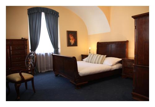 Кровать или кровати в номере Prague Golden Age