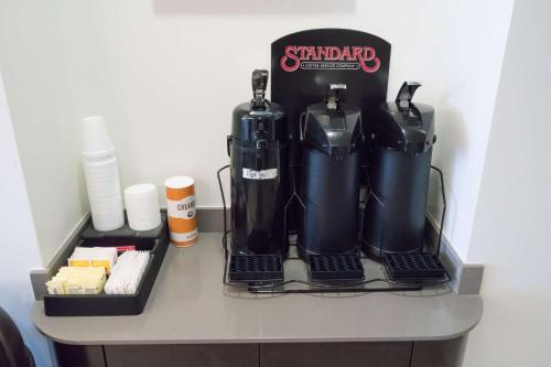 a table with two black gasurgers on it at Motel 6-Pottstown, PA in Pottstown