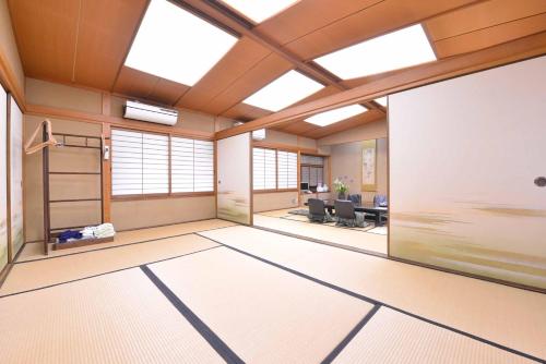 an empty office with a large room with windows at Bingoya in Kurashiki