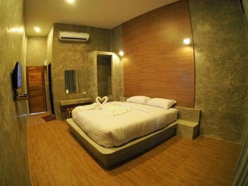 Säng eller sängar i ett rum på Alinda Resort