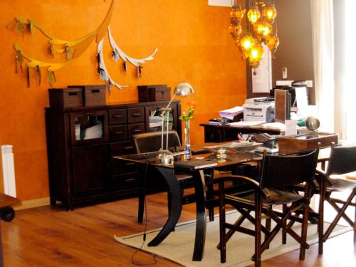 a dining room with a table and some chairs at Hotel el Jardín de Eugenia in Ribadesella