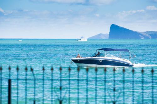 a boat in the middle of the water at Garden Villas in Grand Baie