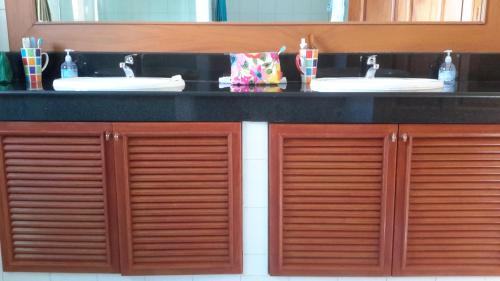 a bathroom with two sinks and a counter top at 3 Bedroom Villa TG11 on Beachfront Resort SDV280-By Samui Dream Villas in Ban Tai