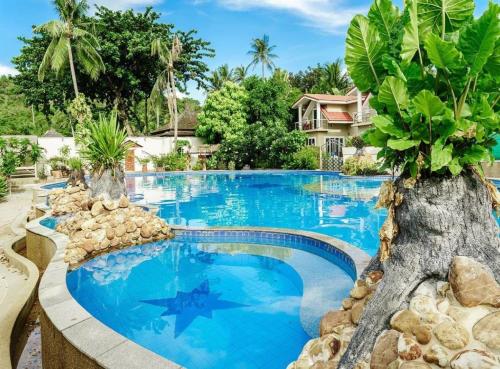 a swimming pool with blue water in a resort at 3 Bedroom Villa TG11 on Beachfront Resort SDV280-By Samui Dream Villas in Ban Tai