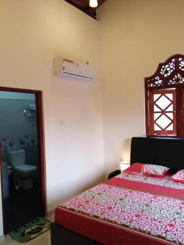 Una cama o camas en una habitación de White Elephant Villa & Restaurant
