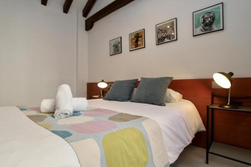 Postel nebo postele na pokoji v ubytování Apartamentos Inside Alhacaba