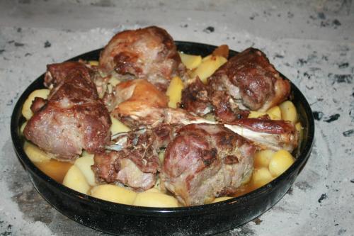 a pan of food with meat and pasta in it at Pension Augustino in Ražanac
