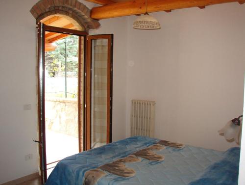 Ένα ή περισσότερα κρεβάτια σε δωμάτιο στο Agriturismo L'Albatro