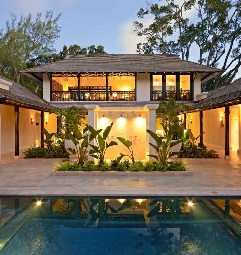 an exterior view of a house with a swimming pool at Coral Reef Club in Saint James