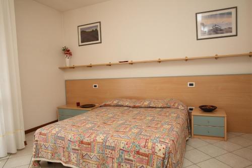 Cama o camas de una habitación en Villini Joker ai Frassini