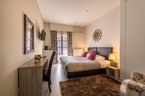 Postel nebo postele na pokoji v ubytování Filoxenia Hotel & Spa