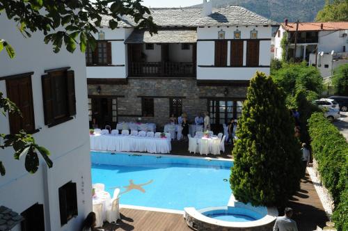 a wedding in the pool at a hotel at Archontiko Naoumidi in Portariá