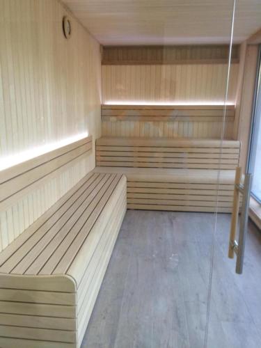 a empty sauna with wooden benches in a room at VVF Aveyron Najac in Najac
