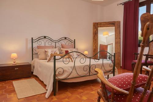 Säng eller sängar i ett rum på Villa del Poggio