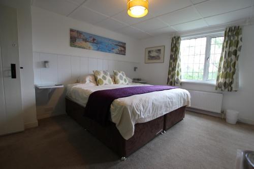 Katil atau katil-katil dalam bilik di Wishing Well Cottage