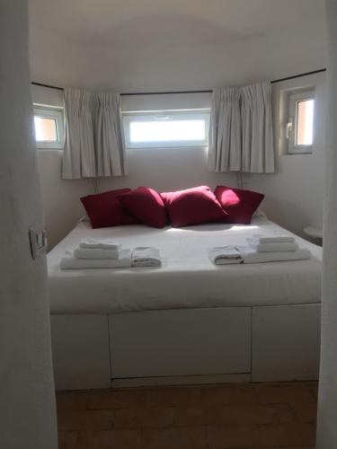 En eller flere senge i et værelse på La Casa Del Faro - Bookwedo