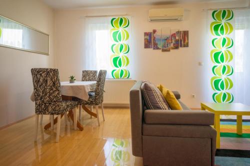 a living room with a couch and a table at Blue Lake Apartment in Zagreb