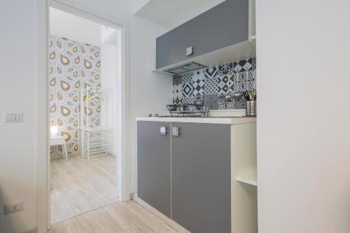 Kuchyň nebo kuchyňský kout v ubytování Flower Suites Sorrento