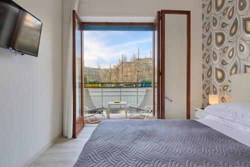Postel nebo postele na pokoji v ubytování Flower Suites Sorrento