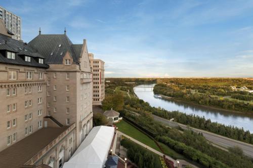 an aerial view of a river between buildings at Fairmont Hotel Macdonald in Edmonton