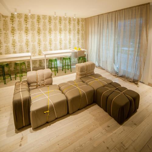 a living room with a couch and a table at Dimora Al Bivacco in Pieve di Cadore