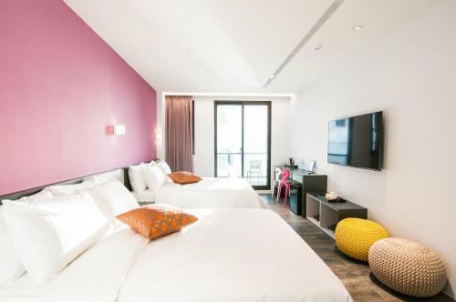 Postel nebo postele na pokoji v ubytování Funson Hotel
