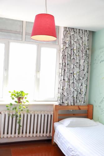 Cama o camas de una habitación en Harbin North International Youth Hostel