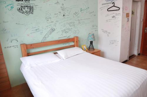 Cama o camas de una habitación en Harbin North International Youth Hostel