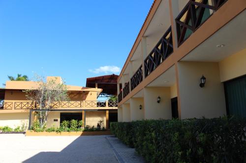 a building with balconies on the side of it at Hotel Roazi in Tizimín