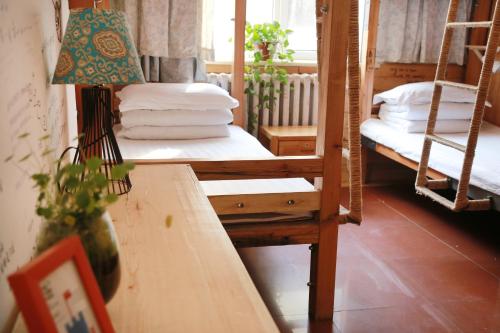 Cama o camas de una habitación en Harbin North International Youth Hostel