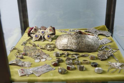 a table topped with a pile of jewellery and a tortoise at Villa Fortuna in Mostar