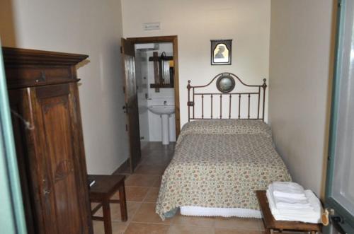 a bedroom with a bed and a toilet in it at Tenuta Tannoja in Andria