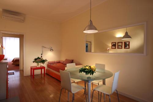 a living room with a table and a couch at Residence Pian della Nave in Milan