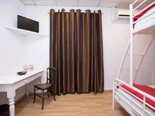 Ένα ή περισσότερα κρεβάτια σε δωμάτιο στο Peters Guesthouse