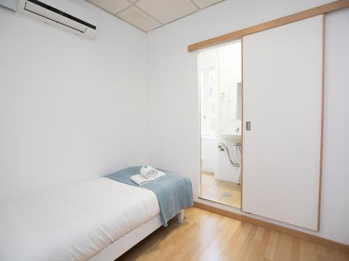 Ένα ή περισσότερα κρεβάτια σε δωμάτιο στο Peters Guesthouse