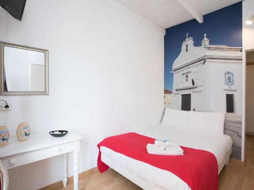 Ένα ή περισσότερα κρεβάτια σε δωμάτιο στο Peters Guesthouse