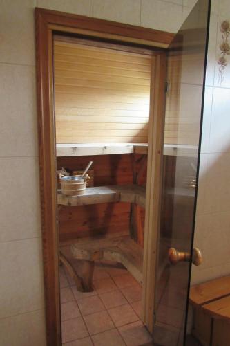 a bathroom with a sink and a window at Arina Holiday House in Nasva