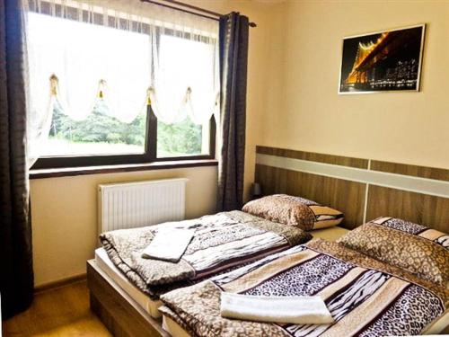 Postel nebo postele na pokoji v ubytování Zajazd Sielankowe Klimaty