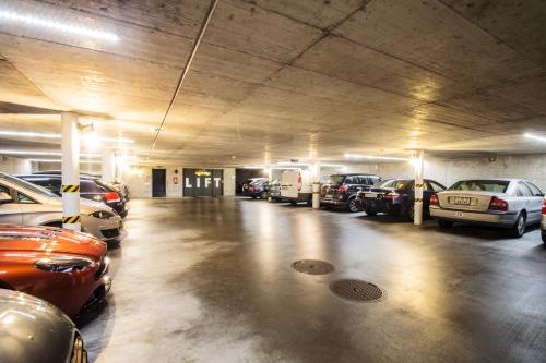 a parking garage with cars parked in it at International au Lac Historic Lakeside Hotel in Lugano