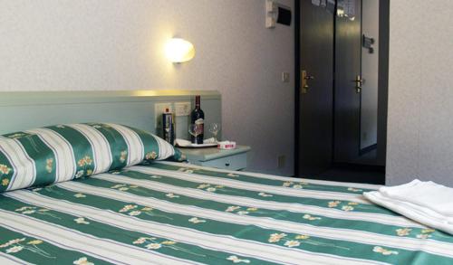 Postel nebo postele na pokoji v ubytování Hotel Aurora