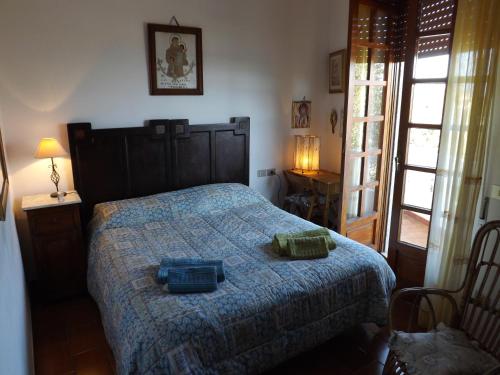 Säng eller sängar i ett rum på Cala Gonone Cozy House Sea View