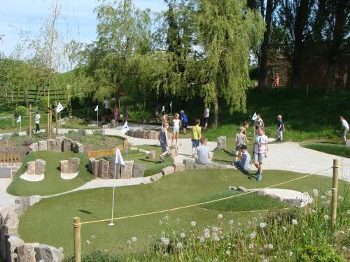 a group of people playing a miniature golf course at Best Western Plus Hotel Fredericia in Fredericia