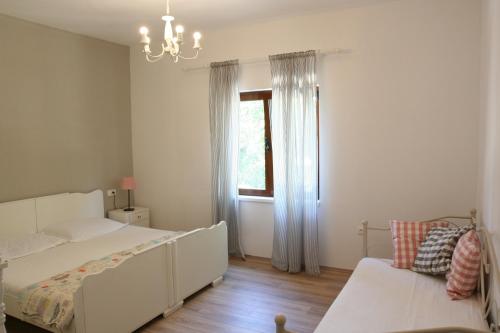 Posteľ alebo postele v izbe v ubytovaní Tiana Apartment