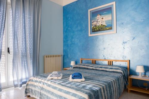 Ein Bett oder Betten in einem Zimmer der Unterkunft Casa Di Bello Affittacamere