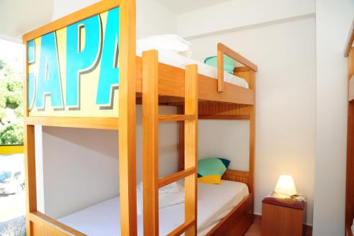 a bunk bedded room with a bunk bed in a house at Caparica Sun Centre in Costa da Caparica