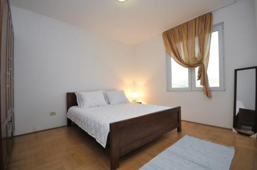 Postel nebo postele na pokoji v ubytování Apartments Spas